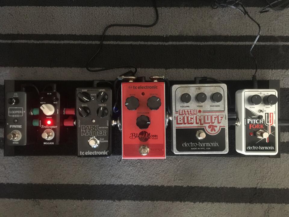 My pedalboard's top. From right to left in order of signal chain: EHX Pitch Fork, EHX Little Big Muff, TC Electronic Blood Moon Phaser, TC Electronic Dark Matter Distortion, Mooer Trelicopter, and a Fame Mini Looper.