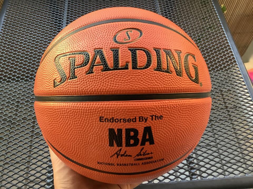 Holding a basketball in my hand.