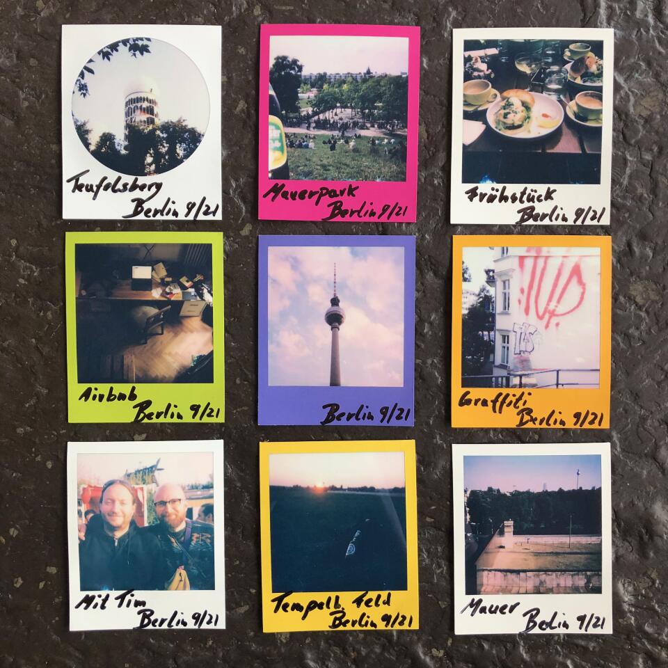9 Polaroids of Berlin subjects arranged in a 3x3 grid laying on a table.