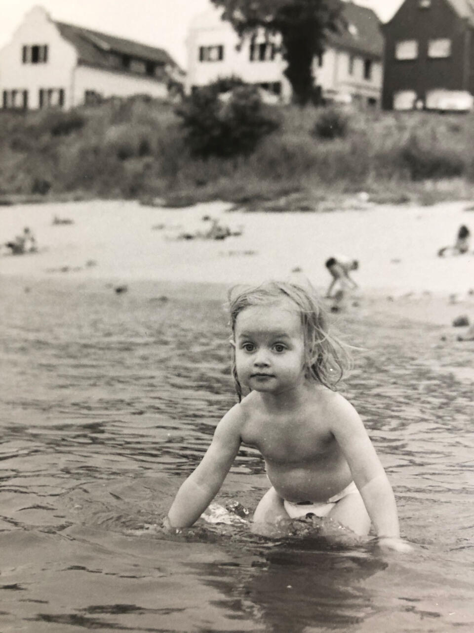 A crop of the child in the water.
