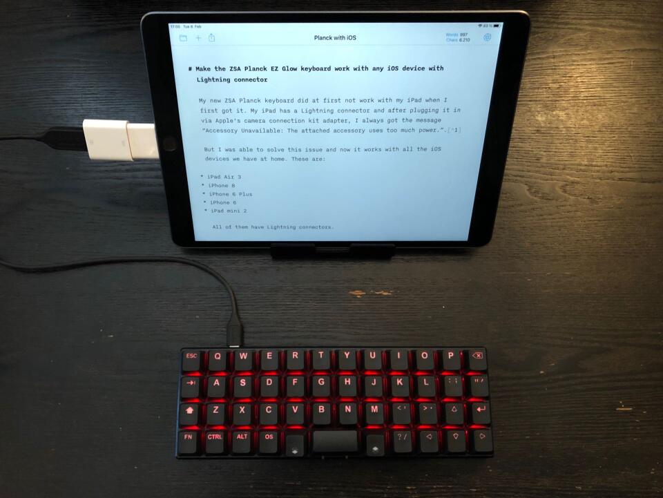My black ZSA Planck EZ keyboard connected to my iPad using Apple's camera connection kit adapter.